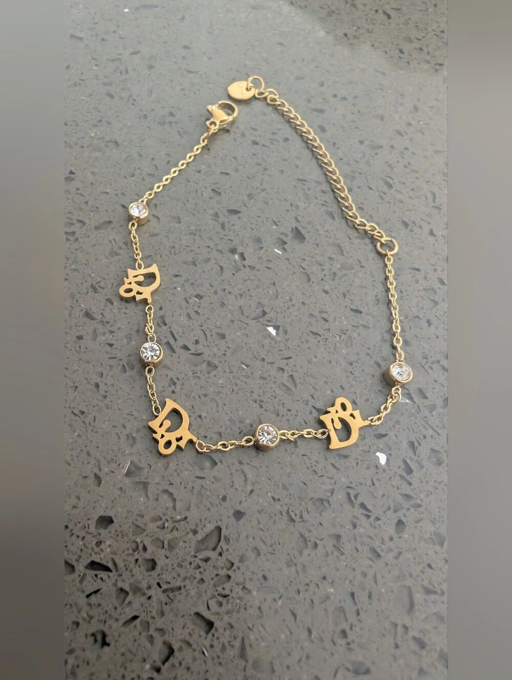 Gold-Tone Script Charm Bracelet with Clear Crystal Accents Stainless Steel